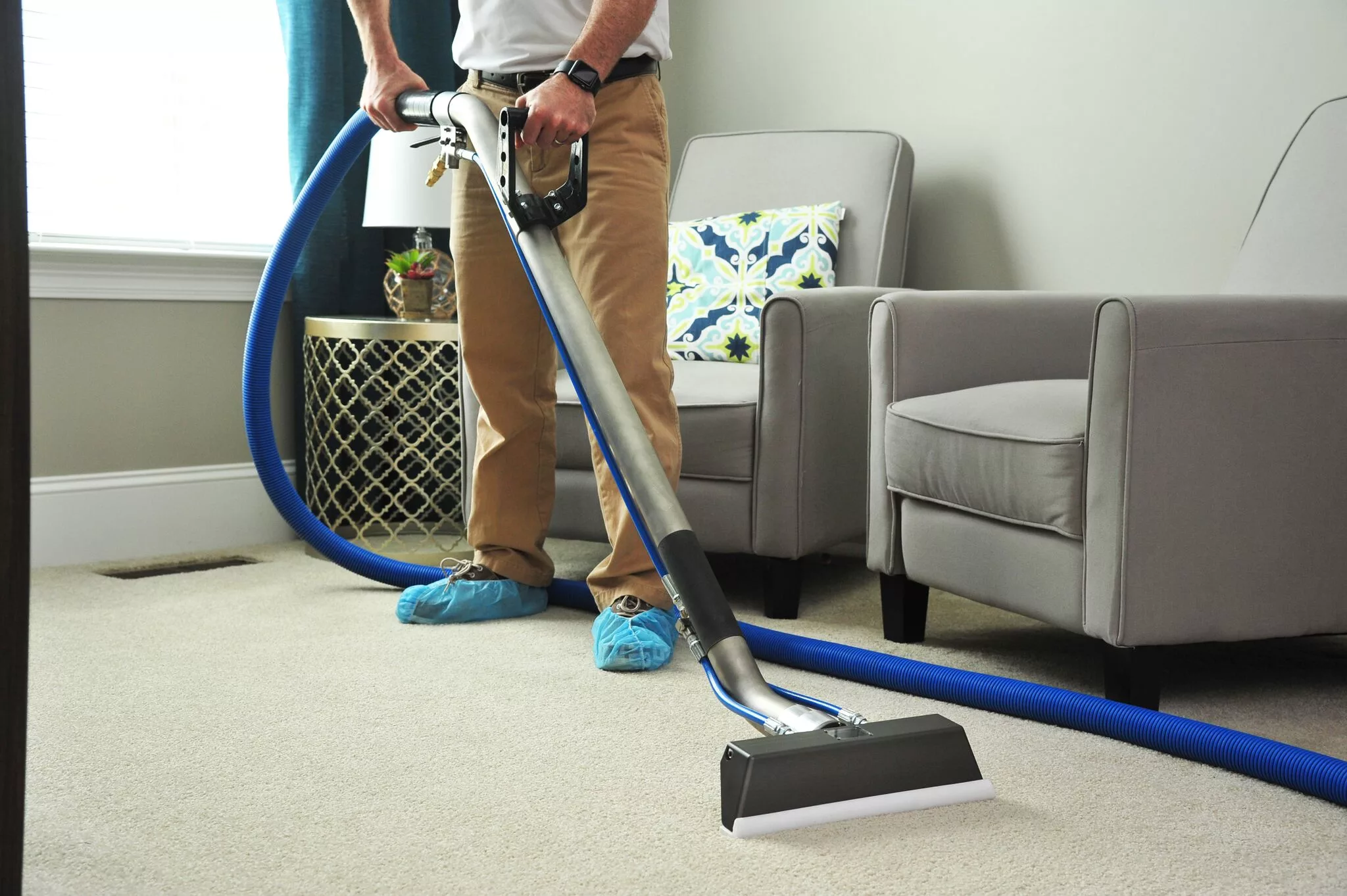 Professional carpet cleaner at work